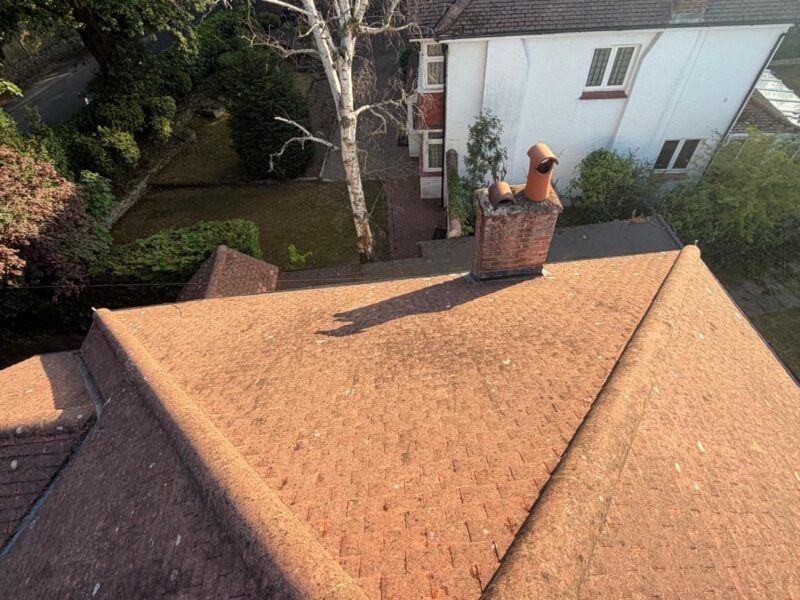 Moss Men waterless roof cleaning in progress on a tiled roof