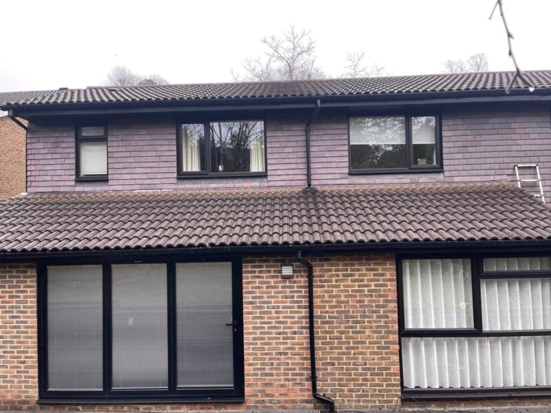 Moss and debris cleared from guttering on a residential property